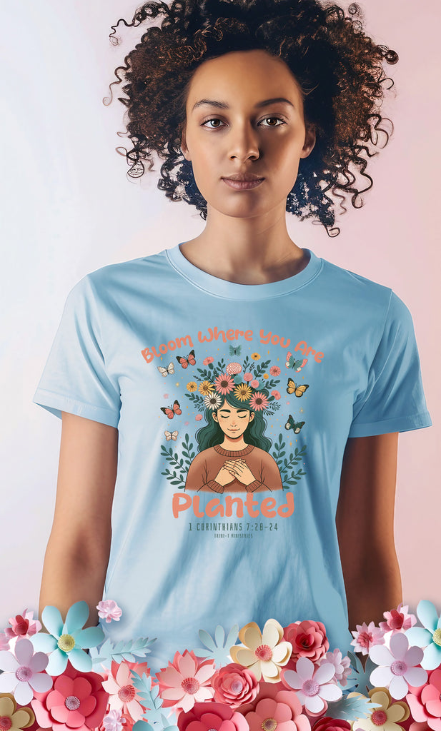 Woman wearing 'Bloom Where You Are Planted' Softstyle Tee in Light Blue