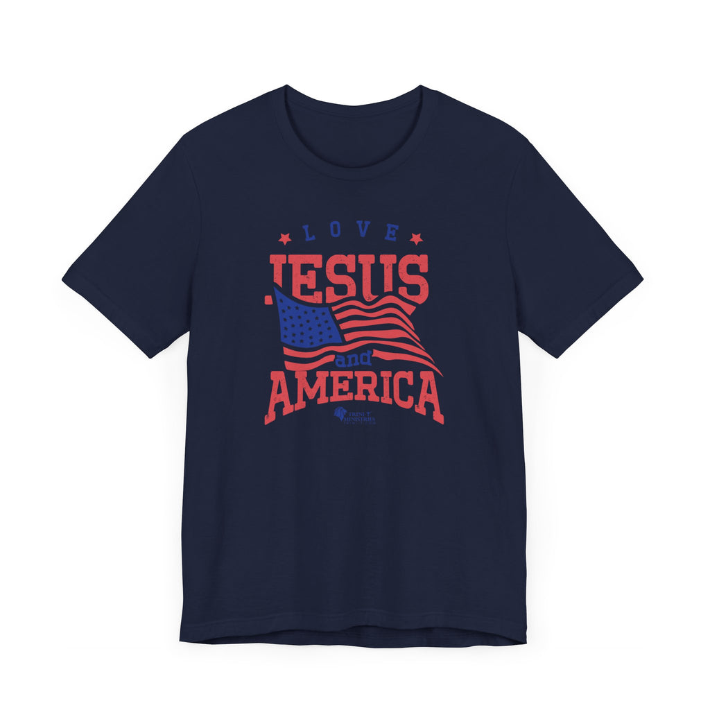 A Navy Blue Bell+Canvas 3001 T-shirt with Trini-T Ministries' Love Jesus and America design. Celebrate your faith and patriotism with our "Love Jesus and America Too" Family T-Shirts. This inspirational graphic tee is perfect for Christians who want to share the Word of God and Jesus, while expressing their love for their country. Ideal for families who enjoy matching outfits during patriotic holidays and special events.