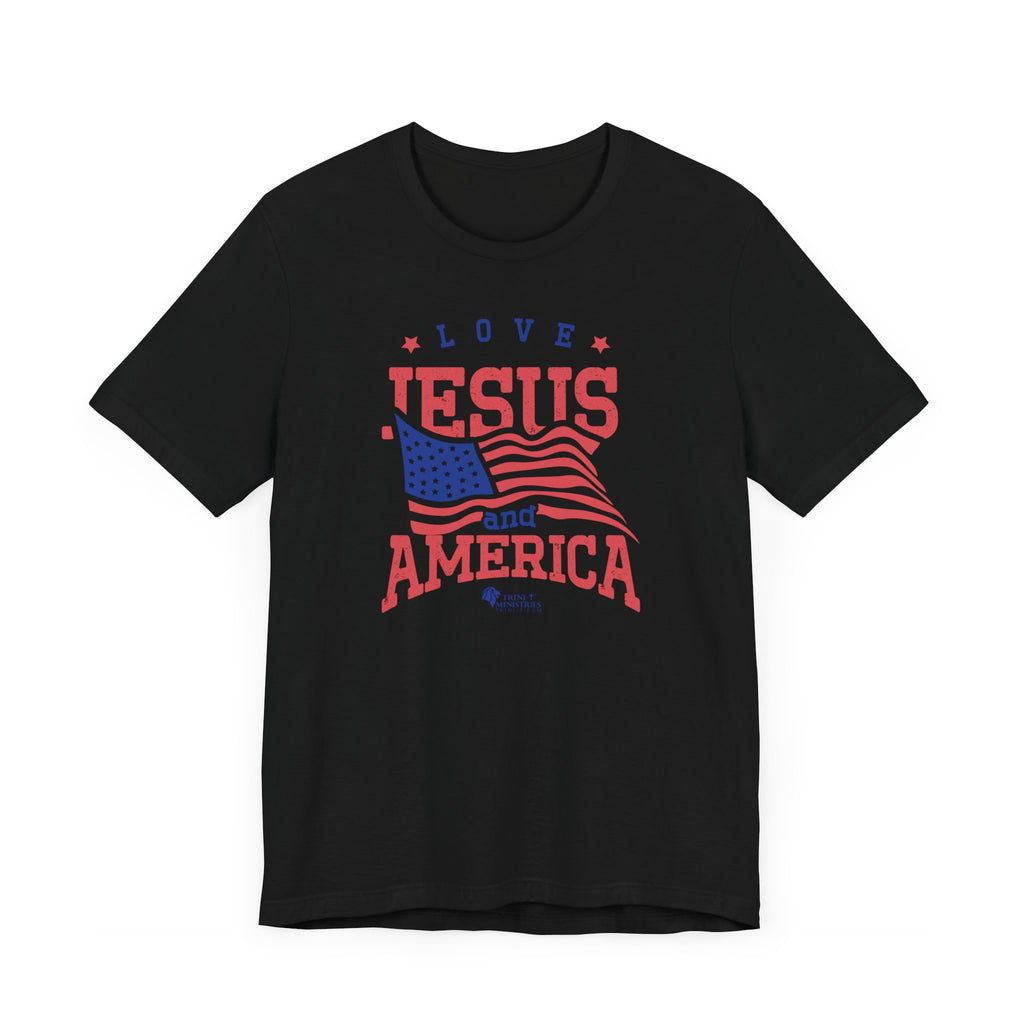 A Black Bell+Canvas 3001 T-shirt with Trini-T Ministries' Love Jesus and America design. Celebrate your faith and patriotism with our "Love Jesus and America Too" Family T-Shirts. This inspirational graphic tee is perfect for Christians who want to share the Word of God and Jesus, while expressing their love for their country. Ideal for families who enjoy matching outfits during patriotic holidays and special events.