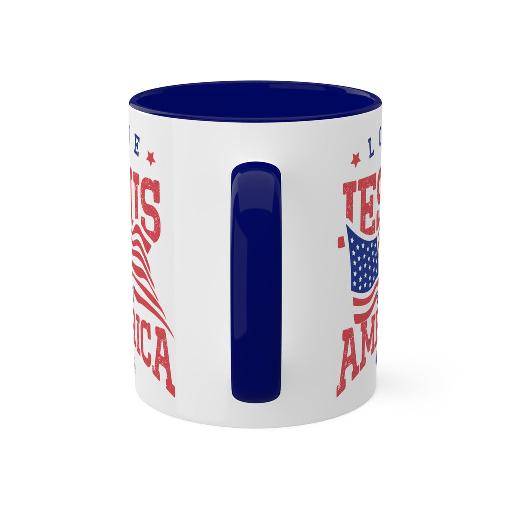 11oz White Mug with blue handle and interior handle on the front. Celebrate your faith and patriotism every morning with our "Love Jesus and America" 11oz Mug. This Christian Patriotic Ceramic Coffee Cup features a bold American flag design and the heartfelt message "Love Jesus and America," perfect for showing your love for God and country.