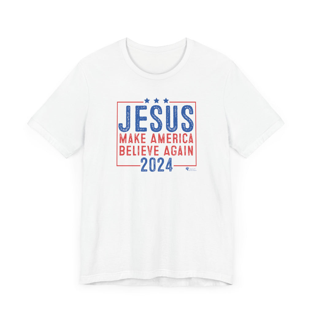 A white Jesus 2024 - Make America Believe Again T-shirt by Trini-T Ministries. Embrace your faith and share a powerful message with our "Jesus 2024 - Make America Believe Again" unisex t-shirt. Designed for Christians who put Jesus above politics and candidates, recognizing Him as our true Savior. This tee blends a playful spoof of political campaigns with a unifying call to believe in Him.