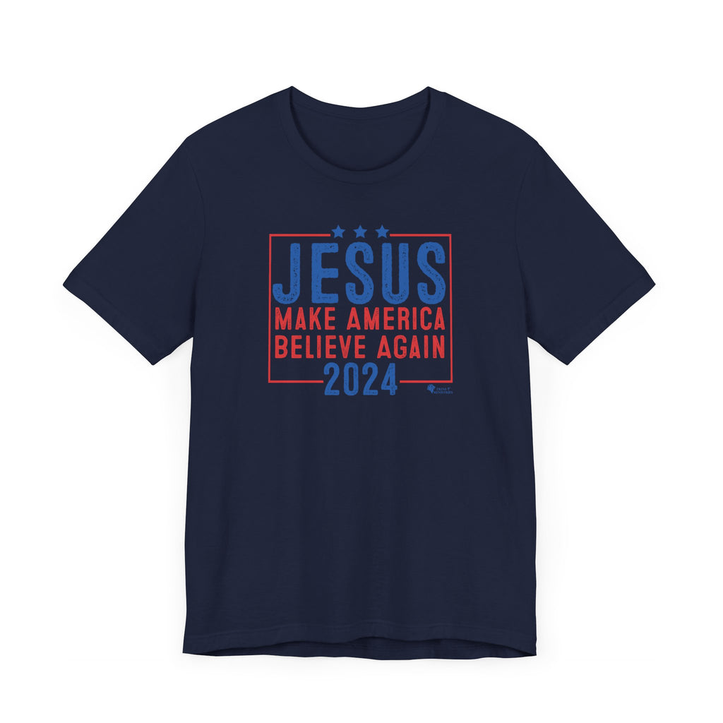 A Navy Blue Jesus 2024 - Make America Believe Again T-shirt by Trini-T Ministries. Embrace your faith and share a powerful message with our "Jesus 2024 - Make America Believe Again" unisex t-shirt. Designed for Christians who put Jesus above politics and candidates, recognizing Him as our true Savior. This tee blends a playful spoof of political campaigns with a unifying call to believe in Him.