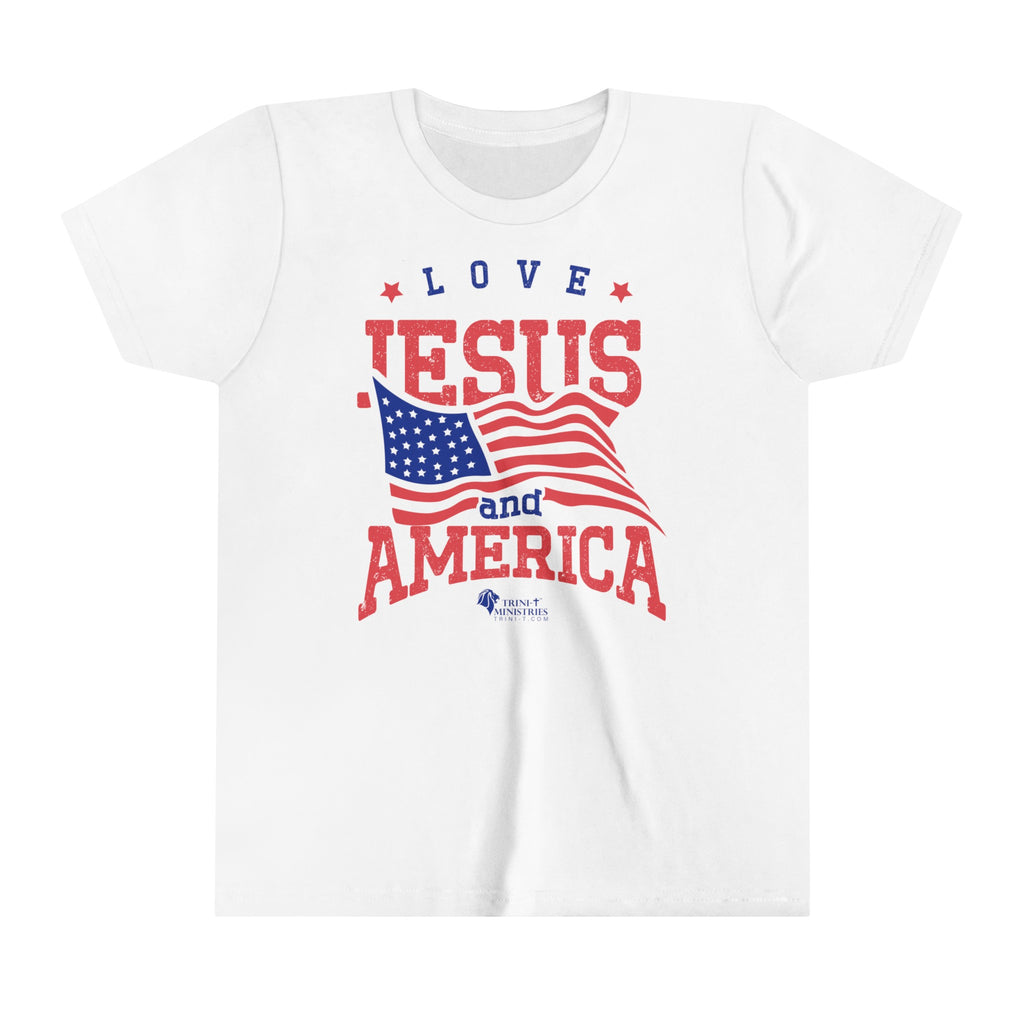 Trini-T Ministries' Love Jesus and America design on a Kid's white bella+canvas 300Y t-shirt. Showcase your children's faith and patriotism with our "Love Jesus and America" Kid's T-Shirt. This charming and inspirational graphic tee is perfect for parents, relatives, and friends who want to share the Word of God and celebrate their love for America through their children's outfit.