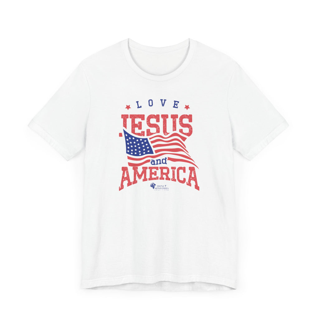 A White Bell+Canvas 3001 T-shirt with Trini-T Ministries' Love Jesus and America design. Celebrate your faith and patriotism with our "Love Jesus and America Too" Family T-Shirts. This inspirational graphic tee is perfect for Christians who want to share the Word of God and Jesus, while expressing their love for their country. Ideal for families who enjoy matching outfits during patriotic holidays and special events.