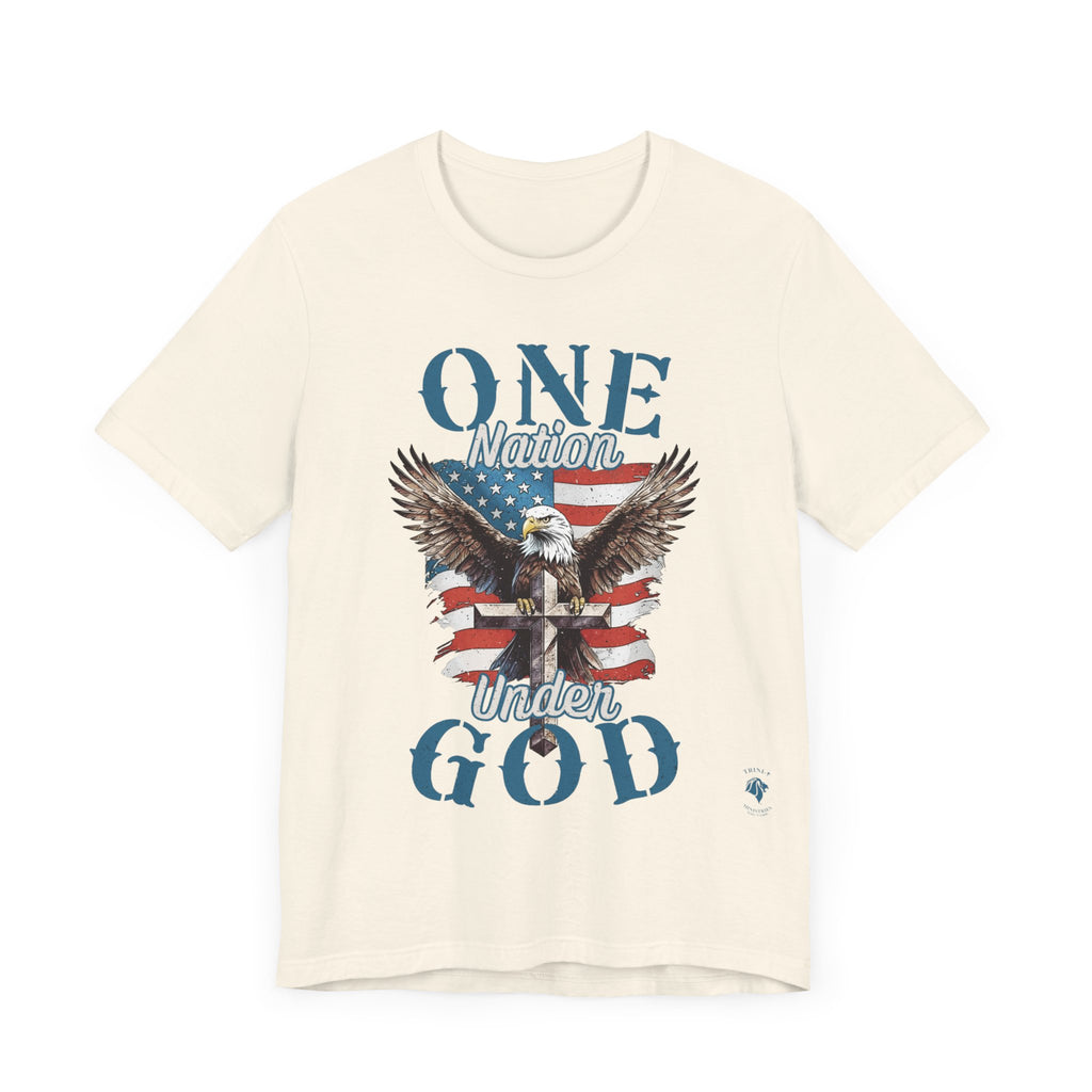 Natural One Nation Under God - Eagle - T-shirt. Wear your faith and patriotism boldly with our "One Nation Under God" patriotic T-shirt. It features a striking design of an American Bald Eagle, a Cross, and the iconic American flag.
