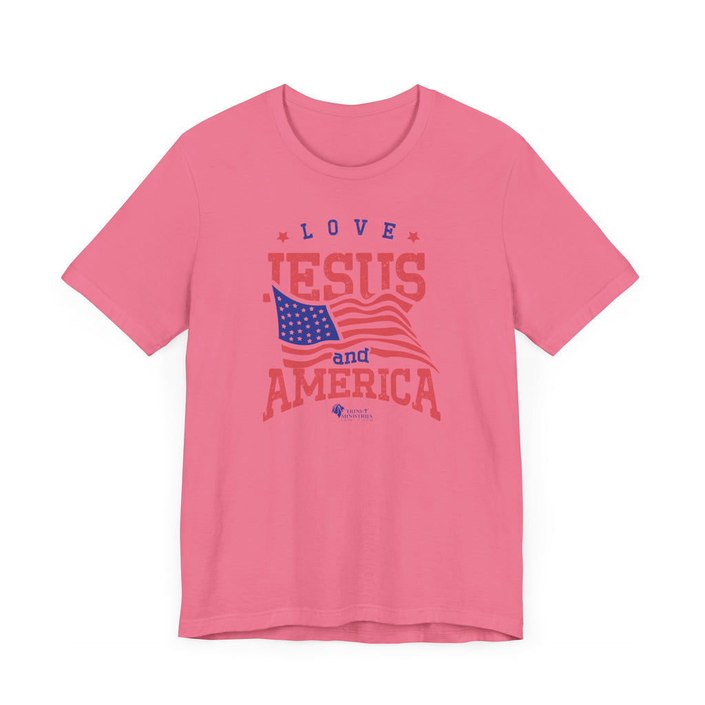 A Pink Bell+Canvas 3001 T-shirt with Trini-T Ministries' Love Jesus and America design. Celebrate your faith and patriotism with our "Love Jesus and America Too" Family T-Shirts. This inspirational graphic tee is perfect for Christians who want to share the Word of God and Jesus, while expressing their love for their country. Ideal for families who enjoy matching outfits during patriotic holidays and special events.