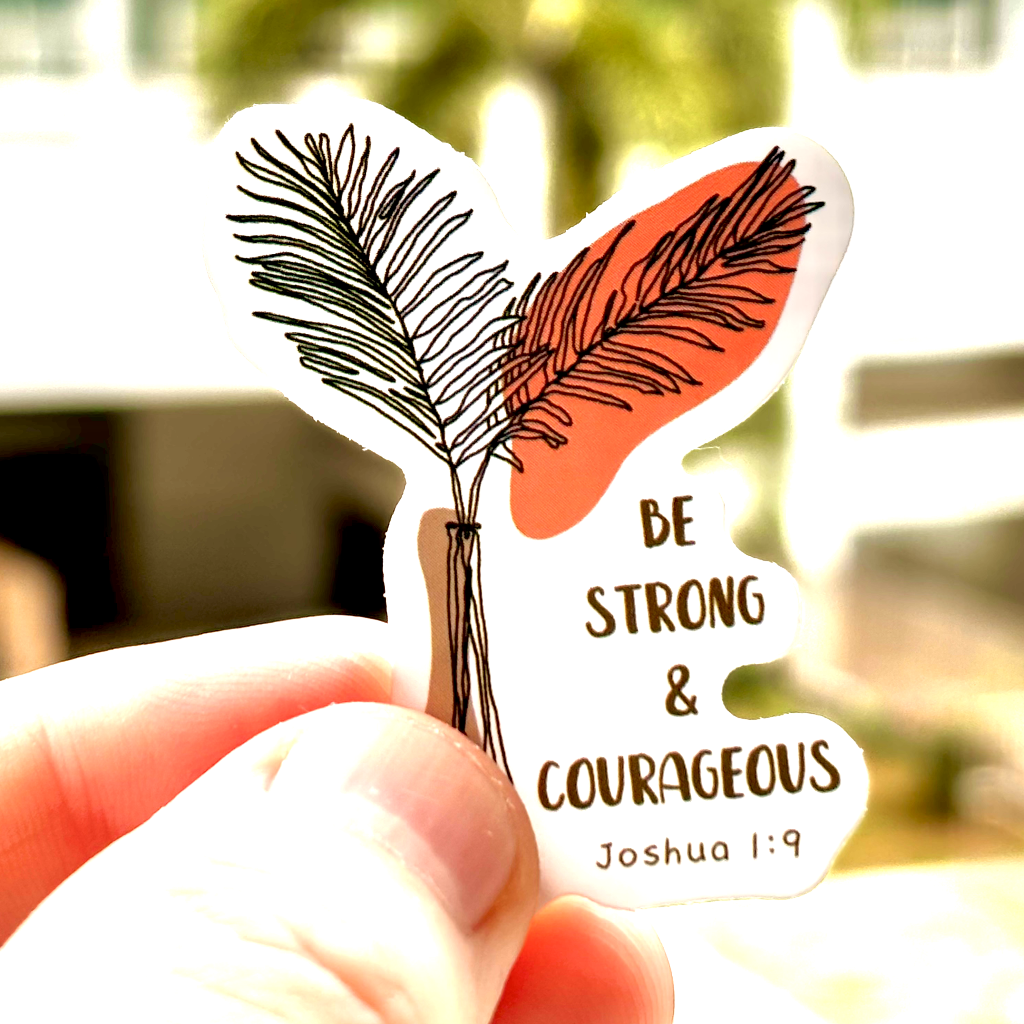 Inspirational sticker with the quote 'Be Strong and Courageous' Joshua 1:19 surrounded by boho floral elements. Ideal for decorating planners, scrapbooks, and more, this sticker brings a message of gratitude and positivity.