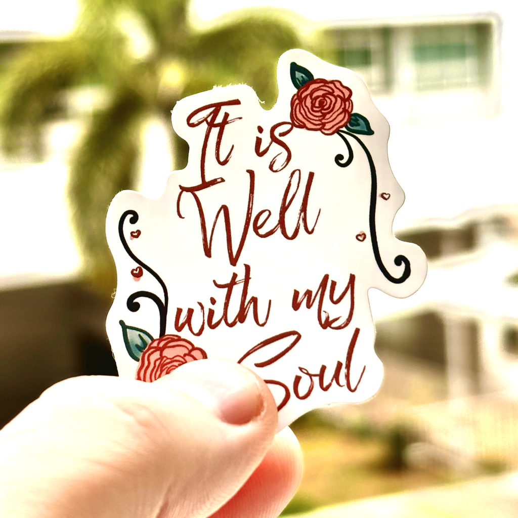 The encouraging message of Psalm 42:7 - 'It is well with my soul.' surrounded by hand drawn roses and hearts is printed on this sticker, making it perfect for a bit of encouragement.