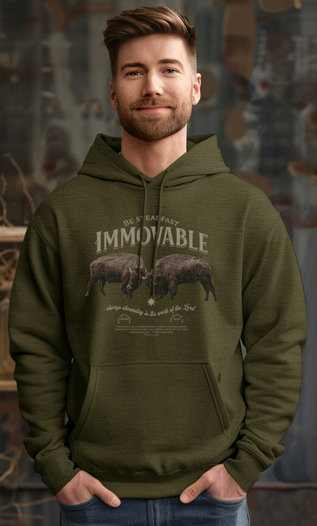 Man in Trini-T Ministries Steadfast and Immovable - 1 Corinthians 15:53 Design on Hoodie - Olive Green