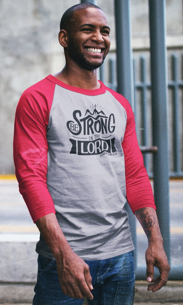 Be Strong In The Lord - Men’s 3/4 Sleeve -  Black/White / XS, Black/White / S, Black/White / M, Black/White / L, Black/White / XL, Black/White / 2XL, Heather Denim/Navy / XS, Heather Denim/Navy / S, Heather Denim/Navy / M, Heather Denim/Navy / L -  Trini-T Ministries