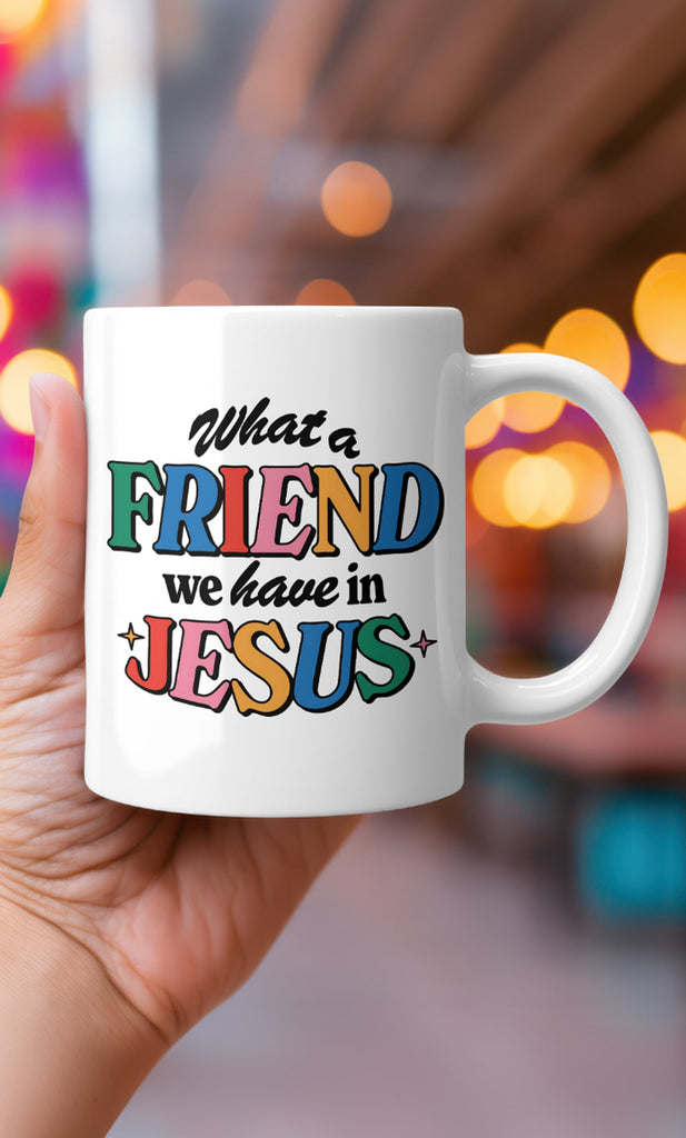 White ceramic mug with colorful text about having the greatest friend in Jesus