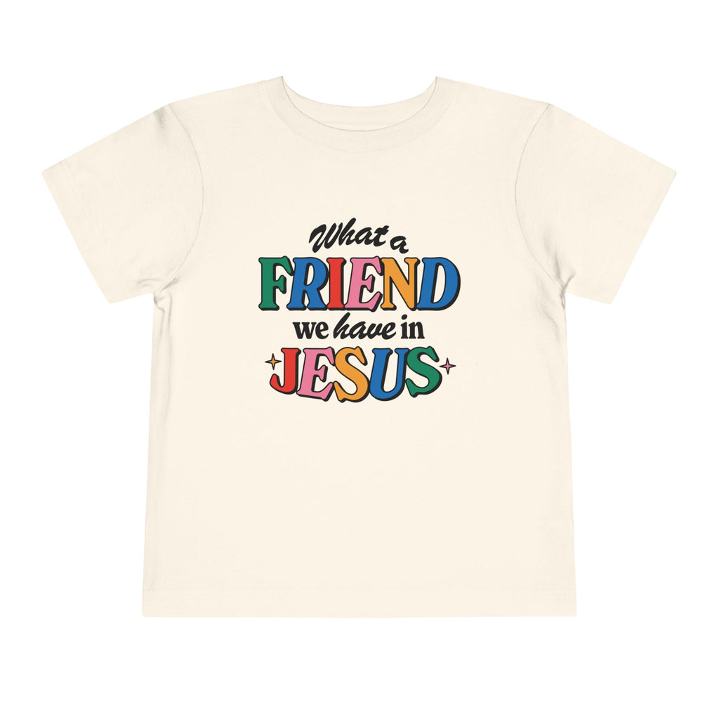 A natural colored Friend in Jesus - Toddler T-shirt with vibrant, multi-colored text reading 'What a Friend we have in Jesus.' This Christian-themed shirt is perfect for little ones to boldly share their faith. Made from soft, breathable fabric, it’s ideal for daily wear or church. The John 15:15-inspired design serves as a sweet reminder of Jesus' friendship.