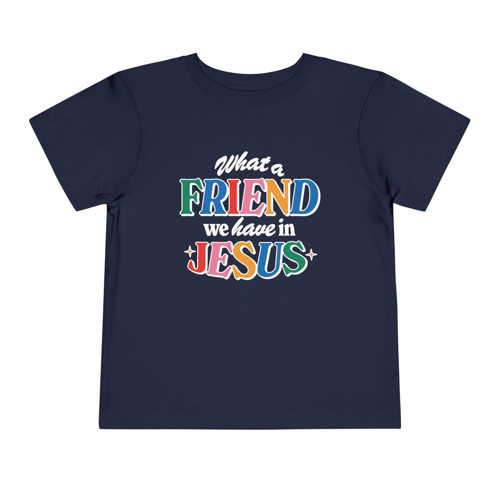 A navy blue Friend in Jesus - Toddler T-shirt with vibrant, multi-colored text reading 'What a Friend we have in Jesus.' This Christian-themed shirt is perfect for little ones to boldly share their faith. Made from soft, breathable fabric, it’s ideal for daily wear or church. The John 15:15-inspired design serves as a sweet reminder of Jesus' friendship.