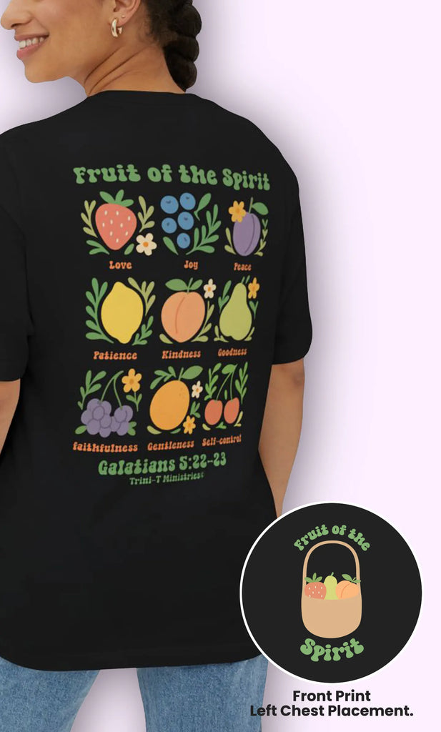 Woman wearing black oversized Christian t-shirt with colorful Fruit of the Spirit back print, Galatians 5:22–23.