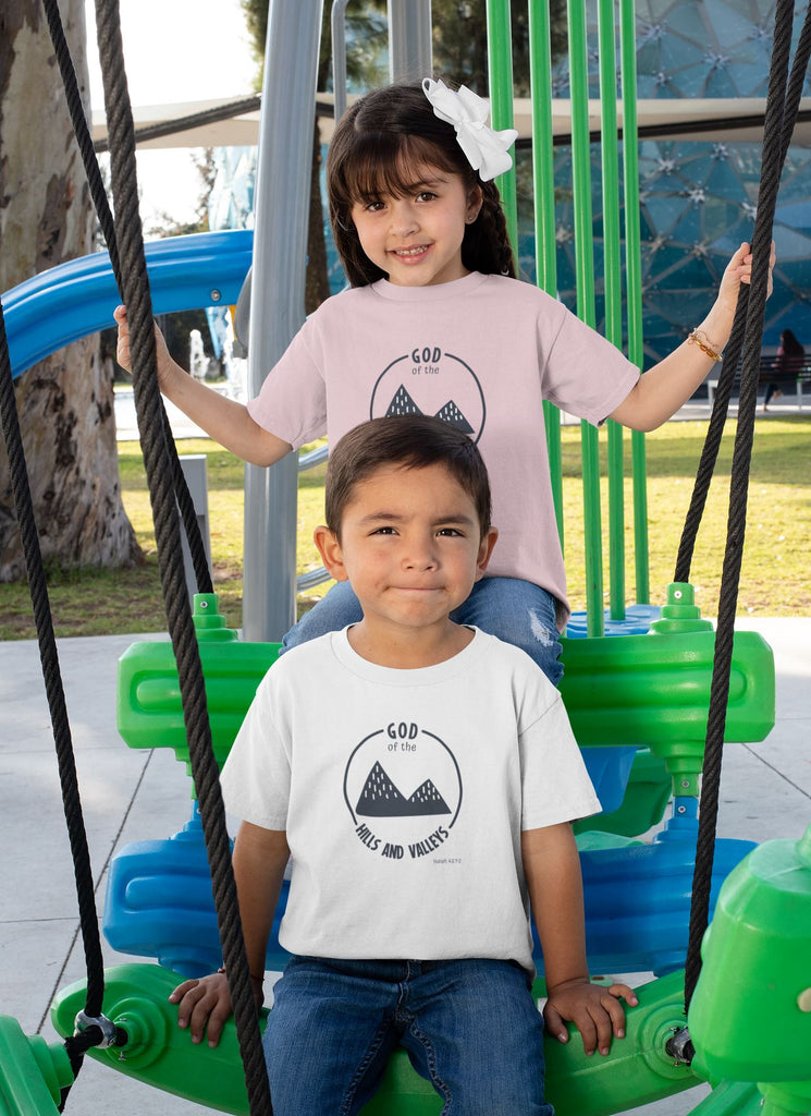 God of the Hills & Valleys - Toddler’s T -  White / 2T, White / 3T, White / 4T, White / 5T, Heather Columbia Blue / 2T, Heather Columbia Blue / 3T, Heather Columbia Blue / 4T, Heather Columbia Blue / 5T, Pink / 2T, Pink / 3T -  Trini-T Ministries