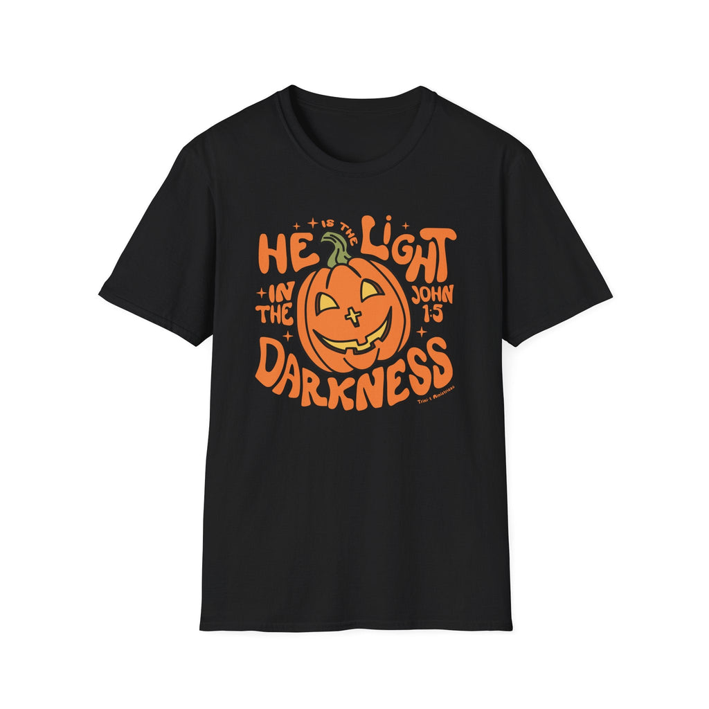 Black t-shirt with "He is the Light" pumpkin design for Christians, featuring John 1:5 to spread the Gospel during Halloween.