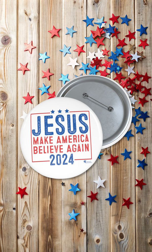 Christian campaign-style button with 'Jesus 2024' message on wooden background with scattered red, white, and blue stars. Faith-inspired political parody pin promoting belief in Jesus.