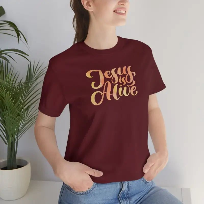 Jesus Is Alive - T -  Maroon / S, Maroon / M, Maroon / L, Maroon / XL, Maroon / 2XL, Maroon / 3XL, Black / S, Navy / S, White / S, Black / M -  Trini-T Ministries