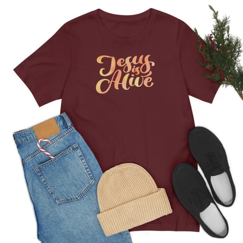 Jesus Is Alive - T -  Maroon / S, Maroon / M, Maroon / L, Maroon / XL, Maroon / 2XL, Maroon / 3XL, Black / S, Navy / S, White / S, Black / M -  Trini-T Ministries