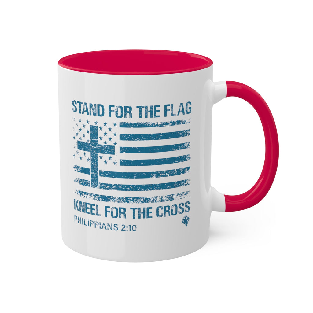 Kneel for the Cross red accented mug from Trini-T Ministries with the handle on the right.  Celebrate your faith and patriotism with our "Kneel For The Cross" Patriotic Christian Mug. This 11oz ceramic coffee cup is perfect for Christians who love to share the Word of God, honor the cross, and express their love for their country. Featuring a bold and inspiring design, this mug is an excellent addition to your morning routine or quiet time.