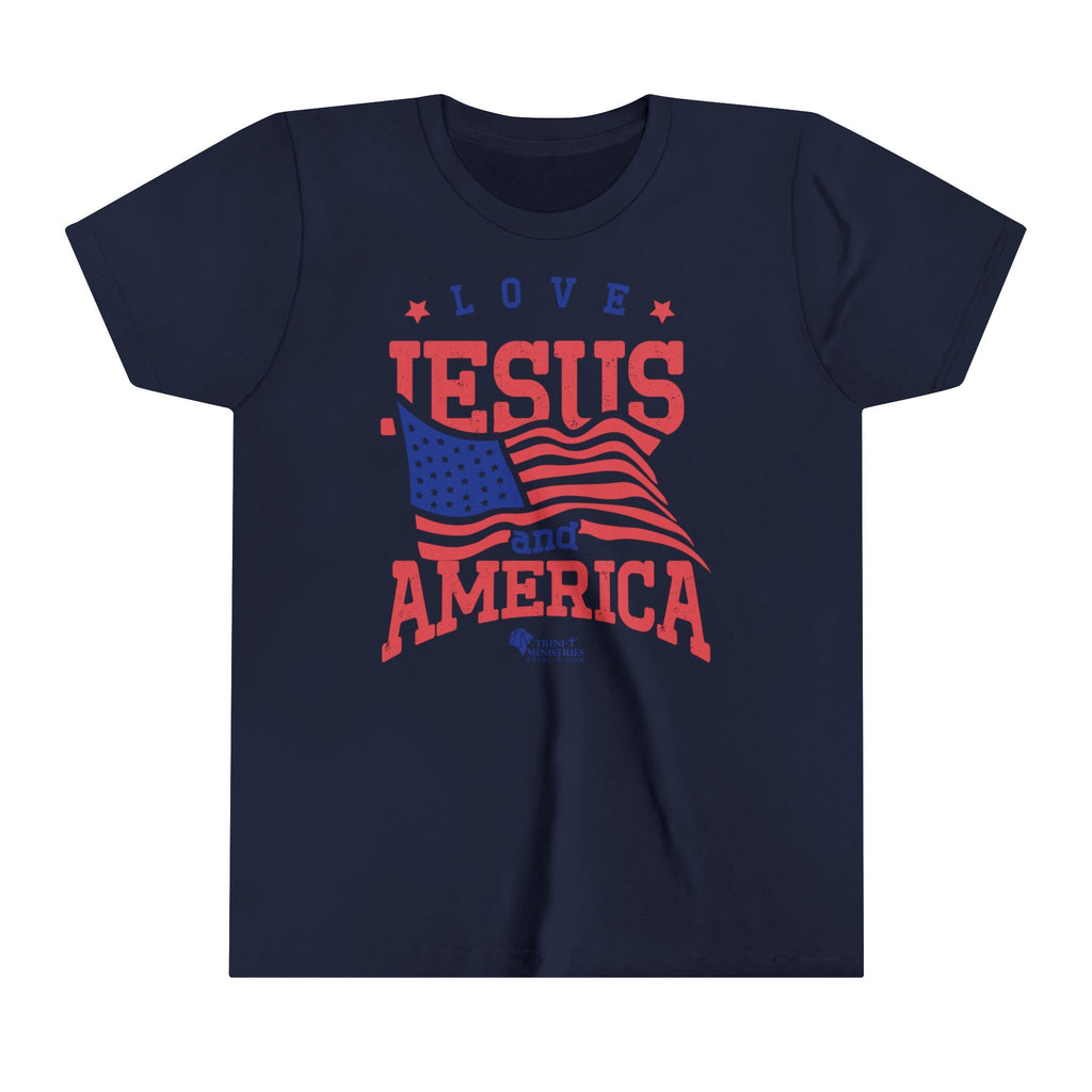 Trini-T Ministries' Love Jesus and America design on a Kid's navy blue bella+canvas 300Y t-shirt. Showcase your children's faith and patriotism with our "Love Jesus and America" Kid's T-Shirt. This charming and inspirational graphic tee is perfect for parents, relatives, and friends who want to share the Word of God and celebrate their love for America through their children's outfit.