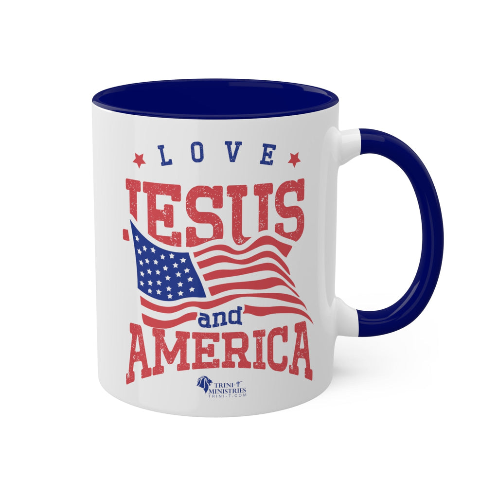 11oz White Mug with blue handle and interior handle on the right. Celebrate your faith and patriotism every morning with our "Love Jesus and America" 11oz Mug. This Christian Patriotic Ceramic Coffee Cup features a bold American flag design and the heartfelt message "Love Jesus and America," perfect for showing your love for God and country.