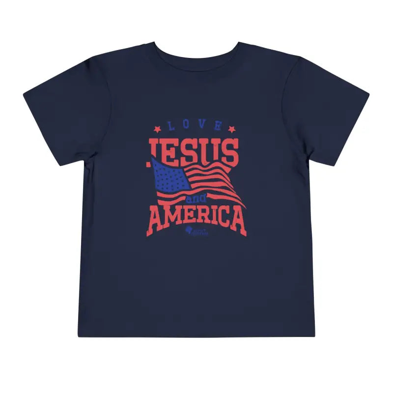 Navy blue Trini-T Ministries' Love Jesus and America Bella+Canvas 3001T shirt. Get our "Love Jesus and America" Toddler T-Shirt to let your toddler display their faith and patriotism. This delightful and motivating graphic tee is ideal for parents, relatives, and friends who wish to spread the Word of God and express their love for America through their toddler's clothing.