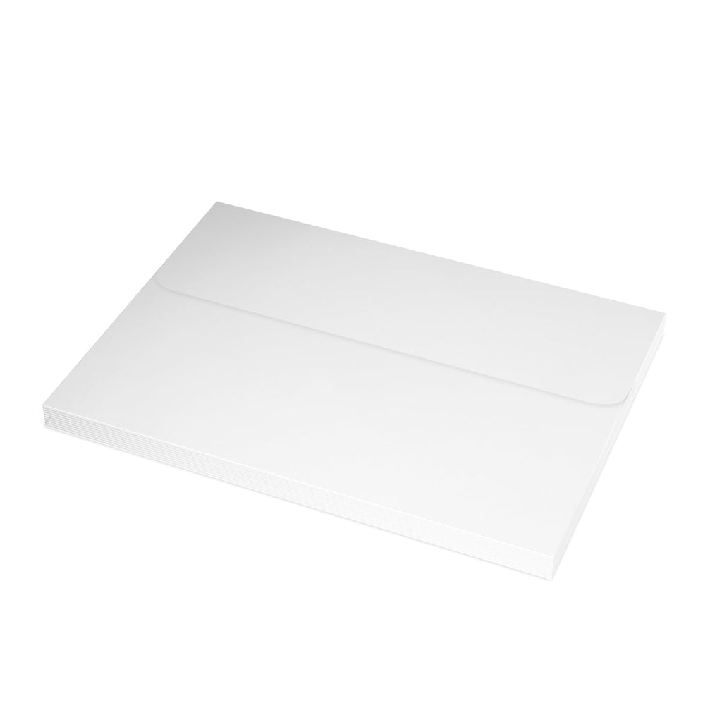 White rectangular cutting board next to Nativity greeting cards for festive cooking