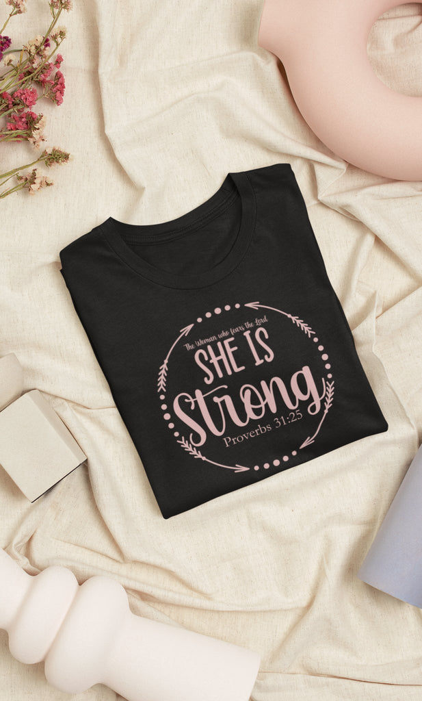 She Is Strong - Women's T -  Navy / S, Navy / M, Navy / L, Navy / XL, Navy / 2XL, Navy / 3XL, Berry / S, Black / S, Red / S, True Royal / S -  Trini-T Ministries